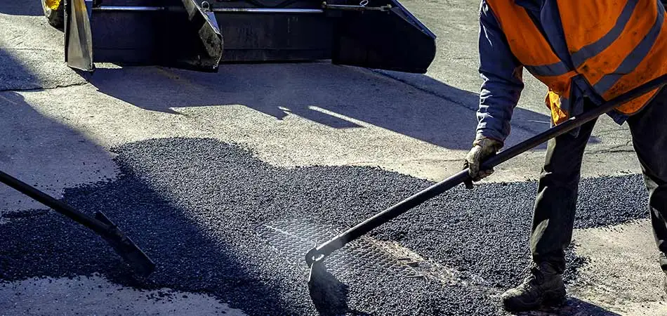 Asphalt parking lot being repaired by J&J Paving in Anne Arundel County. 